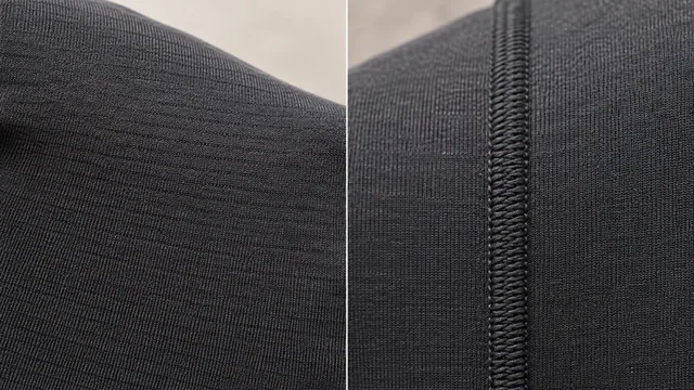 Macro close-up comparison of seamless knit construction versus cut-and-sew overlock seam in dark grey activewear fabric