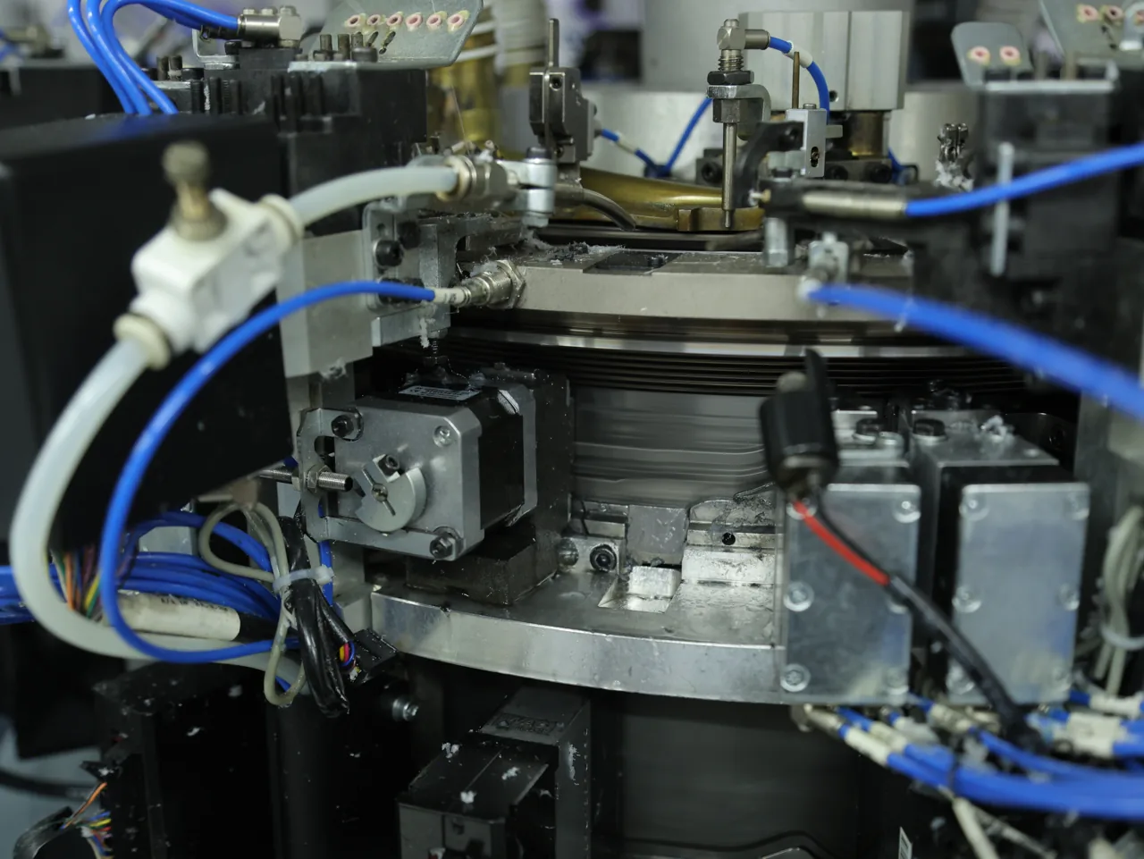 Close-up of knit structure forming on a seamless machine at YOUMEGA